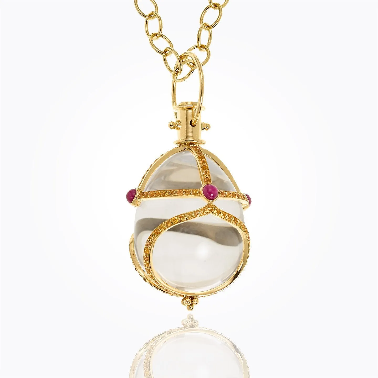 18K Stupa Amulet with oval rock crystal, orange sapphire and ruby