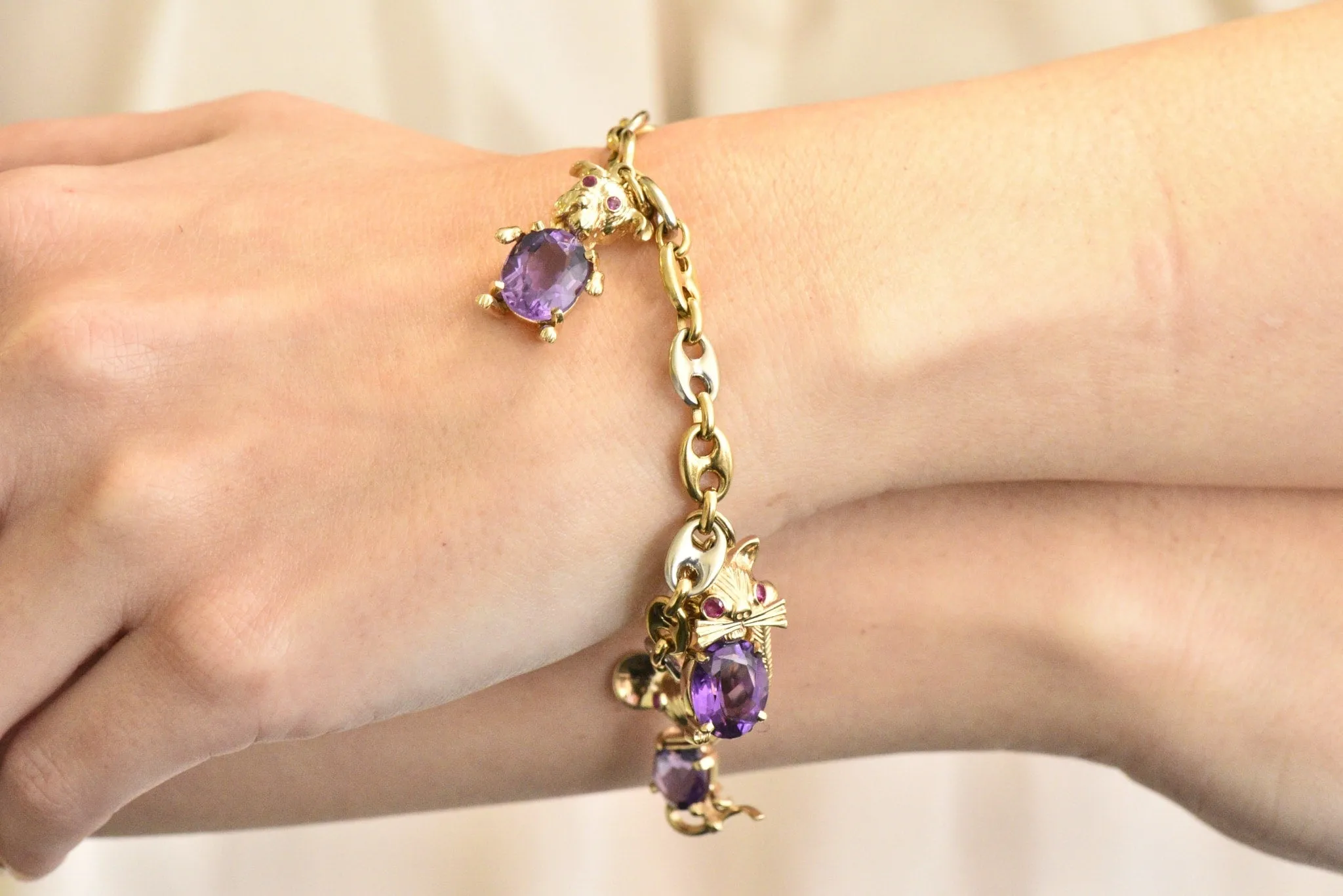 Contemporary 10.70 CTW Amethyst Two-Tone Gold Animal Charm Bracelet