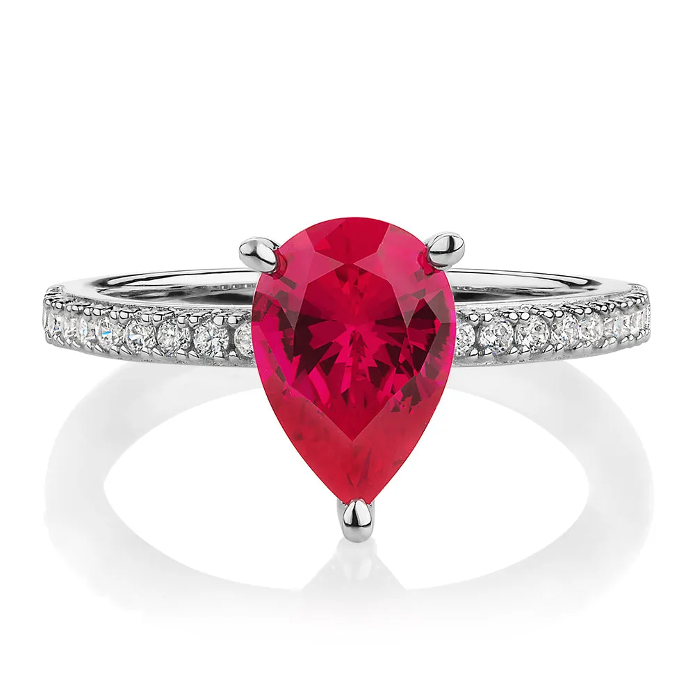 Dress ring with ruby simulant and 0.24 carats* of diamond simulants in sterling silver